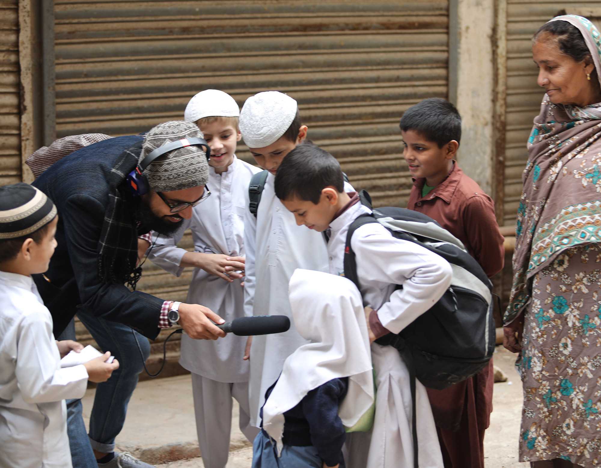 A journalist interviewing a young student.